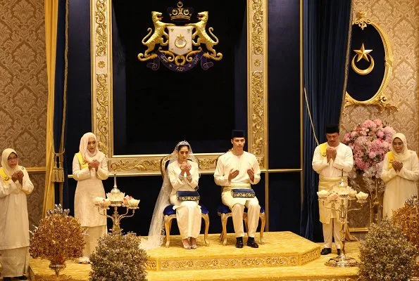 Dutchman Dennis Muhammad and Johor Princess Tunku Tun Aminah Maimunah Iskandariah Sultan Ibrahim, after wedding ceremony at the Istana Besar. wedding dress