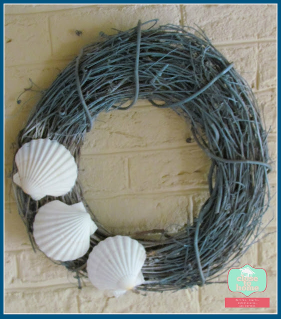 Beach Themed wreaths, blue Summer Crafts like our Simple Beach Theme Wreath are a great way to make an affordable version of a favorite store home decor item! This easy summer crafts idea is perfect for any budget!