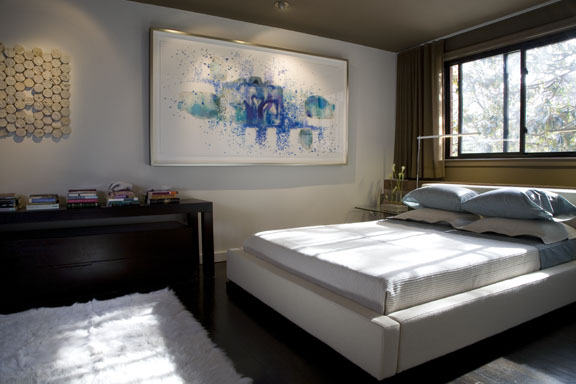Statement artwork is the finishing touch on the bedroom in Ernesto's renovation