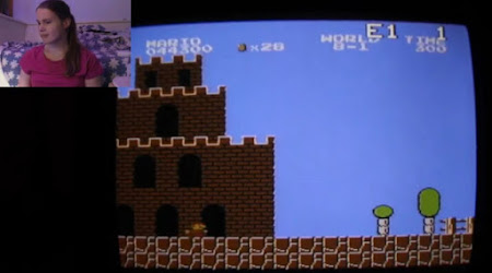 [Image: A screen showing Super Mario Bros., and a smaller picture with Oona in it.]
