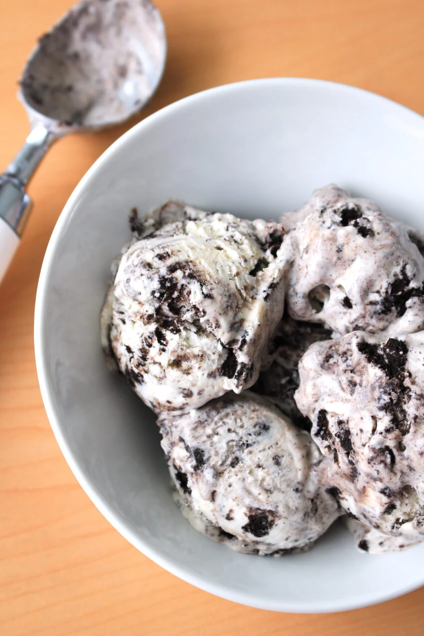 This extra creamy homemade No Churn Cookies and Cream Ice Cream is better than store-bought!  It's full of crushed Oreos and made with just four simple ingredients.  No ice cream maker required! #icecream #oreos #dessert