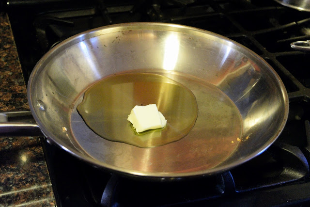 Butter and oil in a skillet on the stove.