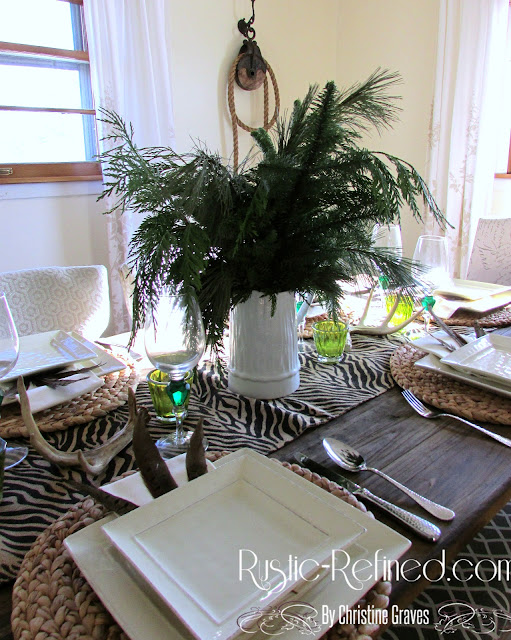 Winter Now flowers needed tablescape using greenery, animal print and rustic touches.