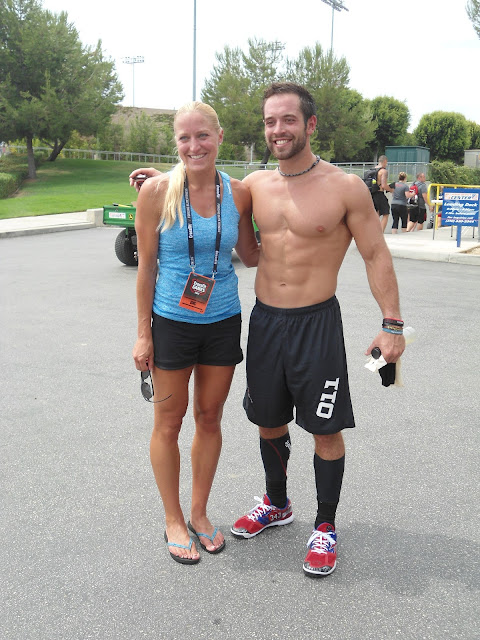 woman posing for a picture with Crossfit athlete Rich Froning Jr. at the 2012 CrossFit Games