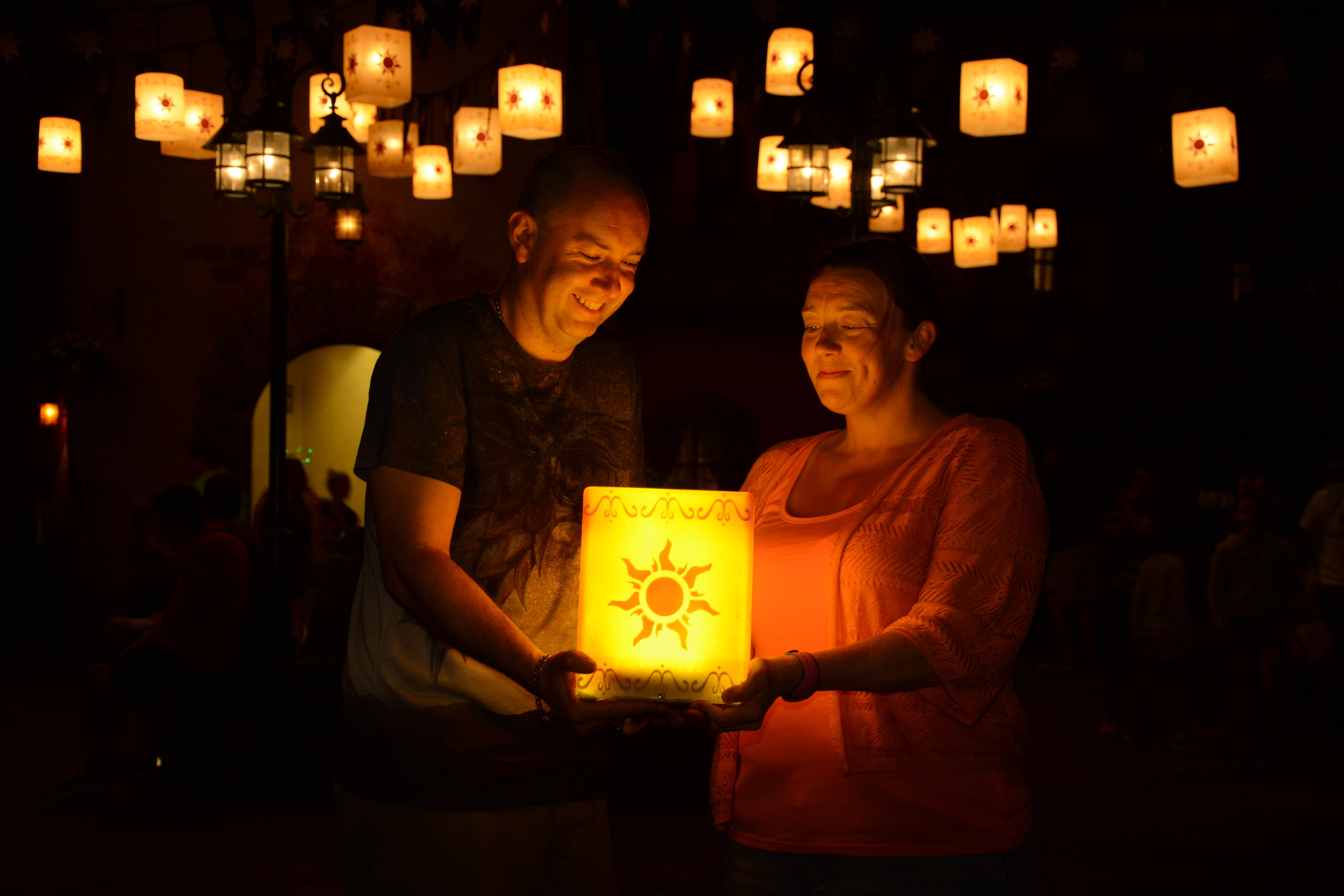 Man and woman holding a tangled lantern