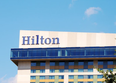 Hilton signage on top of Hilton-America Hotel in Houston Texas