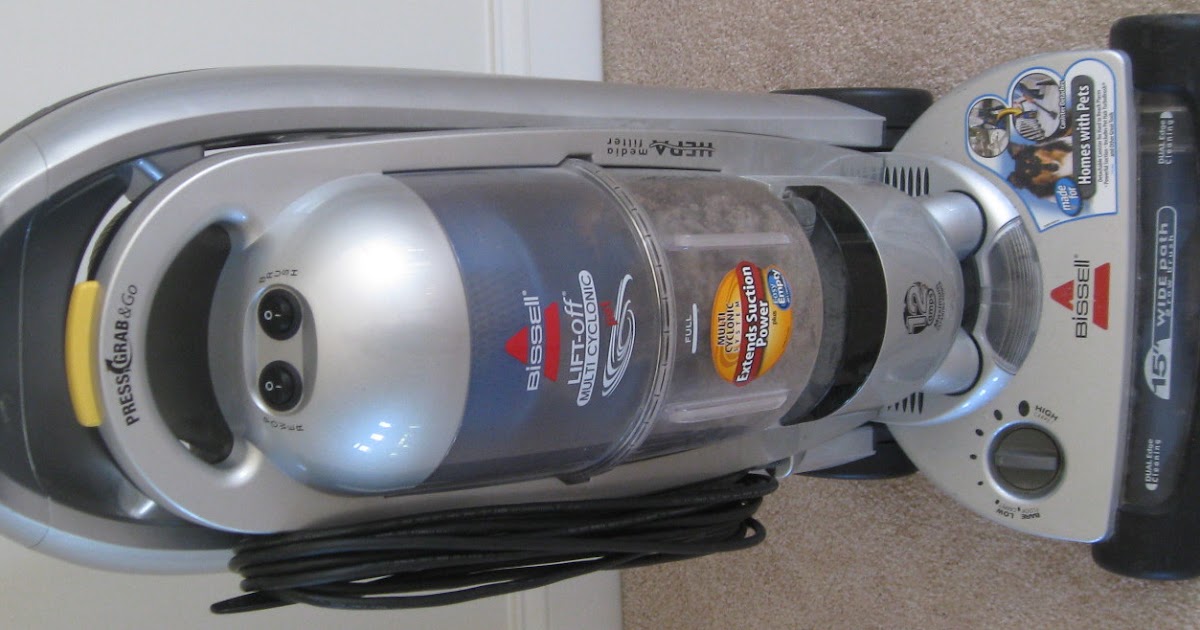 Little Tinker Fixing a Bissell vacuum brush roll