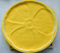 Completely cover with sunflower powder.