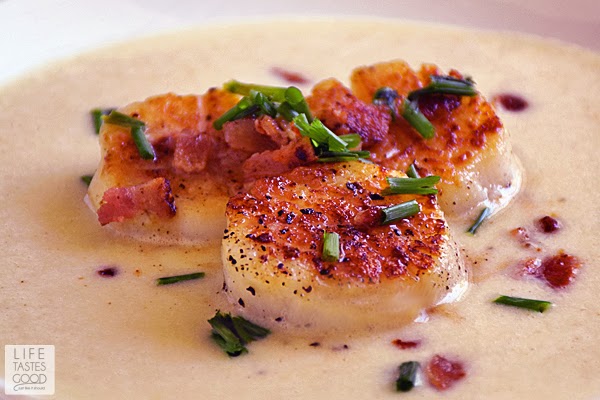 Pan-Seared Scallops with Corn Puree | by Life Tastes Good is a delicious meal that is on the table in about 30 minutes. It is special enough to serve to guests or when you want to enjoy a date night at home. The perfectly seared scallops over creamy corn puree topped off with a little crispy bacon is irresistible!