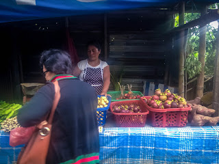Women Seller And Buyer In The Village Of Fruit Traders On The Side Road