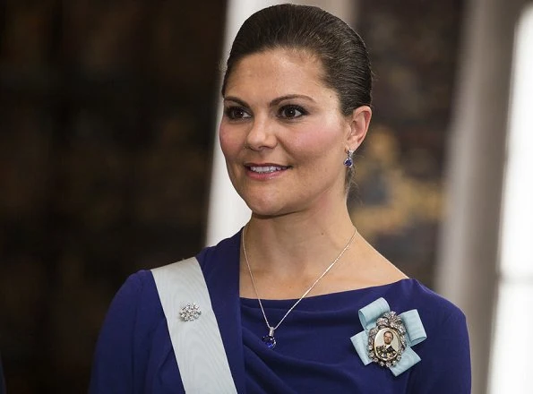 Crown Princess Victoria wore ESCADA Dress and carried Nancy Gonzalez Silver Metallic Clutch