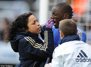 Chelsea Club Doctor Eva Carneiro treats Demba Ba for a broken nose  after being kicked in the face against Newcastle