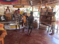 Garifuna drummers and small boys dancing
