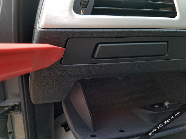 Removing cup holder trim with trim pulling tool
