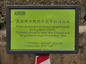 sign indicating dates for trash pickup of new year flowers and tangerines for Lunar New Year