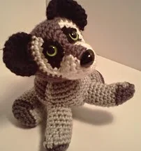 http://www.ravelry.com/patterns/library/benjamin-baby-raccoon-amipal-amigurumi-stuffed-animal-pattern