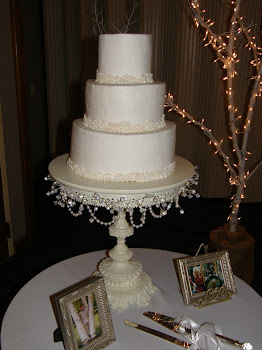 3-tier round buttercream with edible pearls