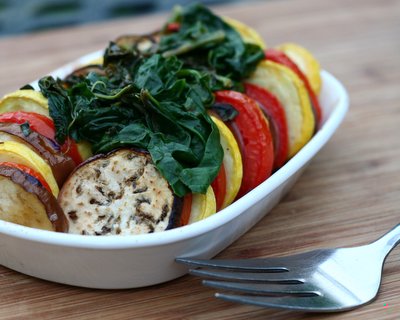 Stacked Ratatouille for One or Two with Spinach ♥ AVeggieVenture.com. Easy, versatile baked eggplant, summer squash and tomato. Low Carb. Paleo. Whole 30. Vegan. WW3.