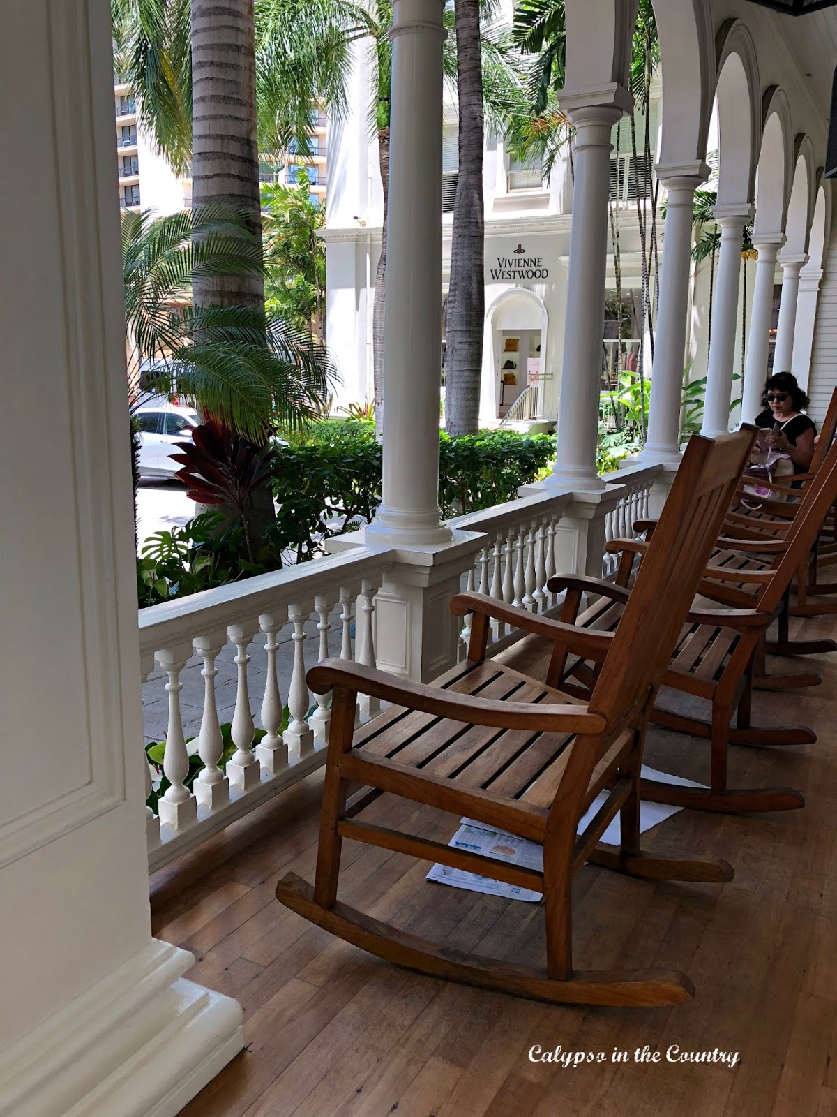 Wooden rocking chairs on the iconic front porch of the Westin Moana Surfrider in Waikiki