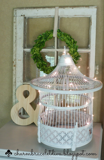 vintage brass bird cage makeover painted white with LED string lights inside