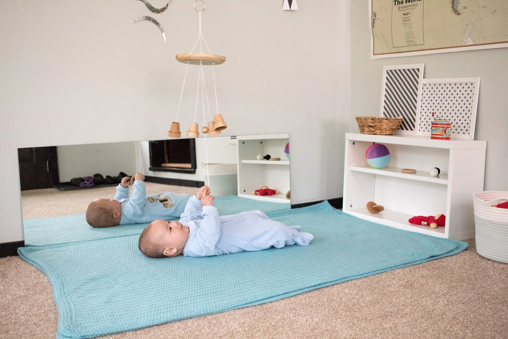 A movement area for a Montessori baby that can move! As a baby starts to roll, some changes need to be made to accommodate play and exploration.