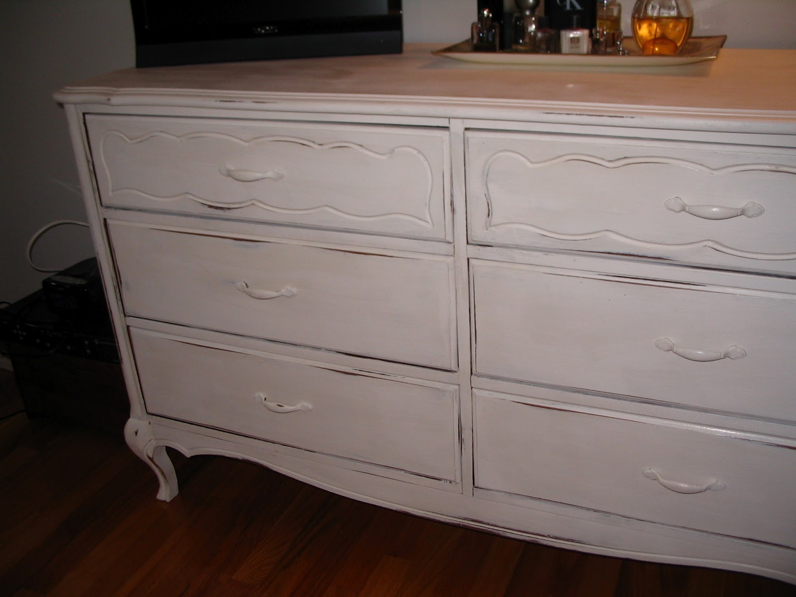 Contented Painter before and after of an old bedroom bureau. painted