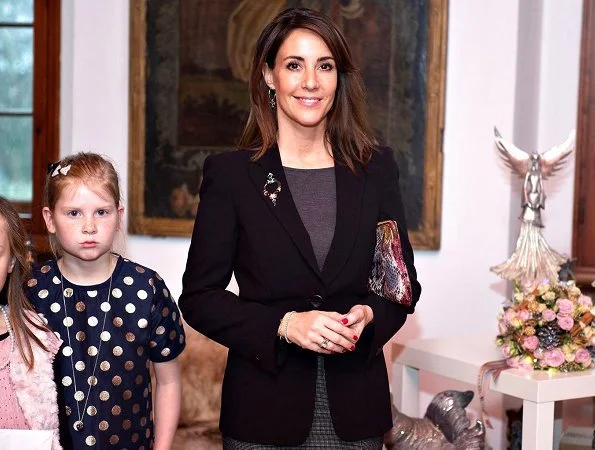Princess Marie attended Christmas celebrations at Voergaard Castle in Vendsyssel. Giorgio Armani blazer and her Jimmy Choo Glynn boots