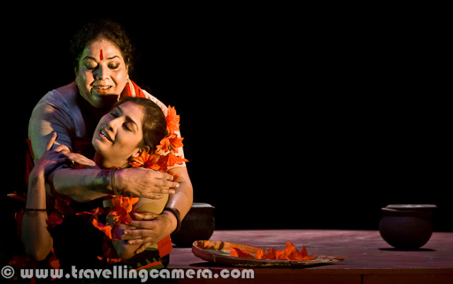 Bharat Rang Mahotsav is one of the popular international theatre festival which is organized by National School of Drama, Delhi with full support from Ministry of Culture. It happened during January month of 2012 (8th Jan to 22nd Jan' 2012). This time PHOTO JOURNEY was invited to this festival as one of the online media partner for this event and covered some of the plays. Let's have a quick Photo Journey to some of the plays here...--------------------------------------------------------------------------------King of the Dark Chamber is a symbolic play. It is not divided into acts and scenes. It reflects Tagore's philosophy and the relationship between an individual and the universe. In the play, King Symbolizes God and the Dark Chamber, where he resides, represents inner-self of man. Click on above photograph to have a quick Photo Journey from this play on Inaugural Day of Bharat Rang Mahotsav...'Grotowski - An Attempt to Retreat' was presented to Bharangam audience on second day of 14th Bharat Rang Mahosatv. It's directed by Tomasz Rodowics, who has also acted in the play. Click on above Photograph to have another PHOTO JOURNEY from this play at Kamani Auditorium, Delhi... RED HOT was one of the best plays showcased during Bharangam 2012. Tickets for RED HOT play were booked in few hours and many of the folks could not see this play. Click on above photograph to have a quick Photo Journey for those folks and don't miss it next time...A theatre production co-produced by The Japan Foundation and Theatre Roots & Wings, `The Water Station` is a two-hour, wordless performance, written by an award-winning Japanese playwright Shogo Ohta, and directed by Sankar Venkateswaran, with an all-India cast selected by auditions across the country. Click on above photograph have a quick Photo Journey of 'The Water Station' play from 14th Bharat Rang Mahotsav 2012...Byomkesh play was performed at 14th Bharat rang Mahotsav 2012. It was one of the exciting plays of Bharangam 2012. It was performed in Kamani and whole auditorium was full of audience from various parts of the country. Click on above photograph to have a quick Photo Journey of Byomtesh, a Bengali play with English subtitles...Tagore’s Chandalika tells the tale of Prakriti, an untouchable girl forced to live on the periphery of society as ‘chandalika’. No one want to play with her, people keep distance from her but at times increase closeness for their selfish reasons. Chandilika by Tagore is based on a story from a Buddhist text... and here I would like to highlight that 14th Bharat Rang Mahotsav 2012 is also a platform to celebrate Rabindarnath Tagore's 150th Birthday. Many of his plays were shown during Bharangam 2012 !!!