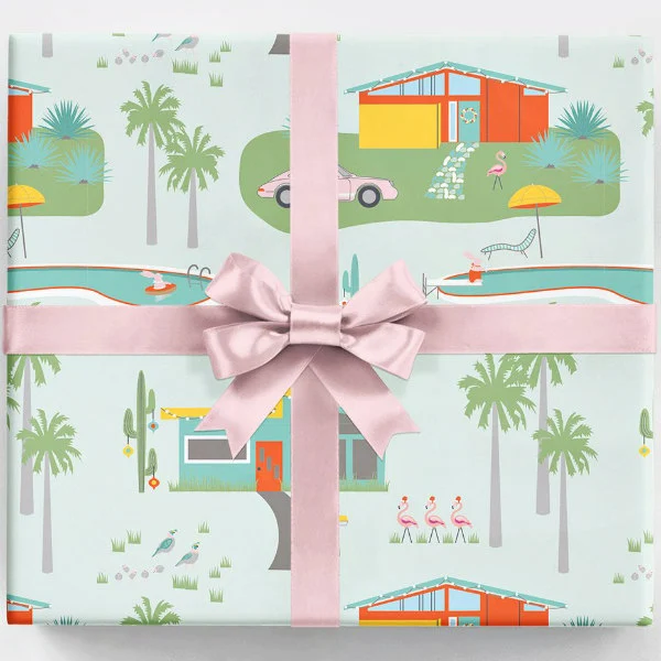 retro Palm Springs wrapping paper on square package with pink ribbon and bow
