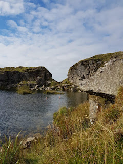 Quarry pool on Dartmoor, with two happy swimmers bobbling about