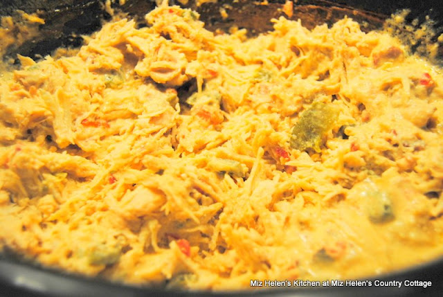 Slow Cooker Cheesy Ranch Chicken Sandwich is a flavorful dish that can be used as a sandwich, dip or a main dish. It is a great busy day recipe. Miz Helen's Country Cottage