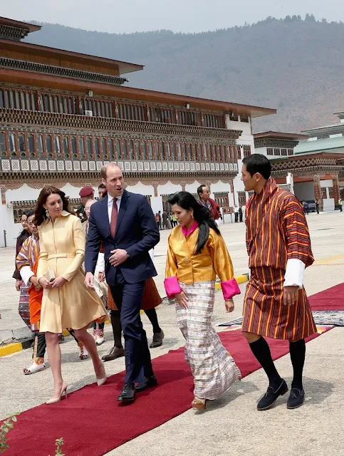 Prince William, Duke of Cambridge and Catherine, Duchess of Cambridge arrive into Paro International Airport for the first day of a two day visit to Bhutan. Kate wore Emilia Wickstead soft-yellow gold bespoke coatdress
