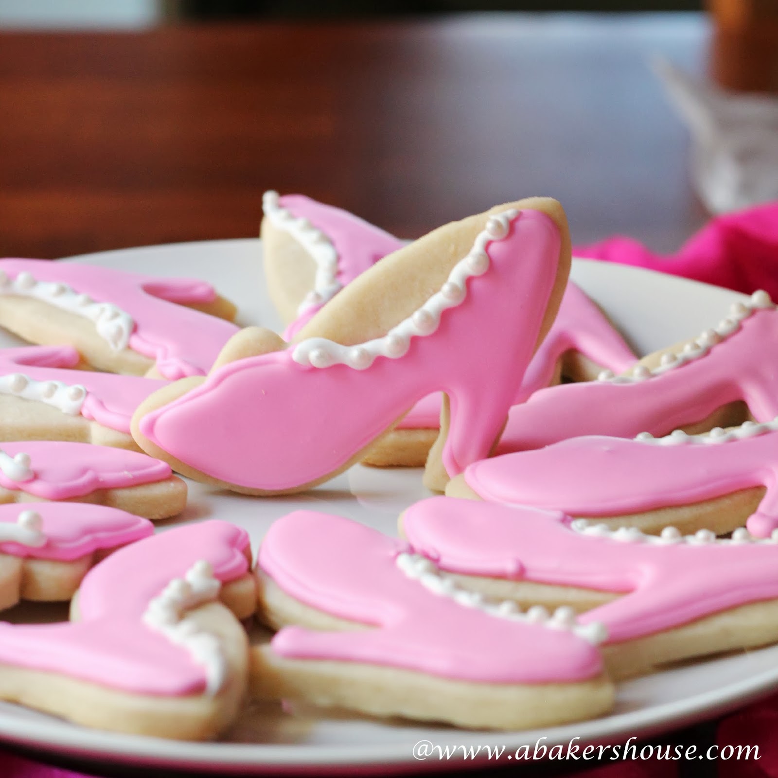 plate of decorated cookies in the shape of high heels