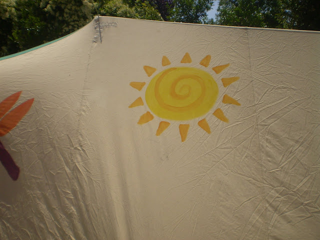 painting a canvas tent with fabric paints