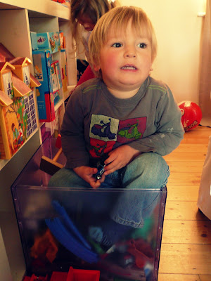 wee one in a toy box