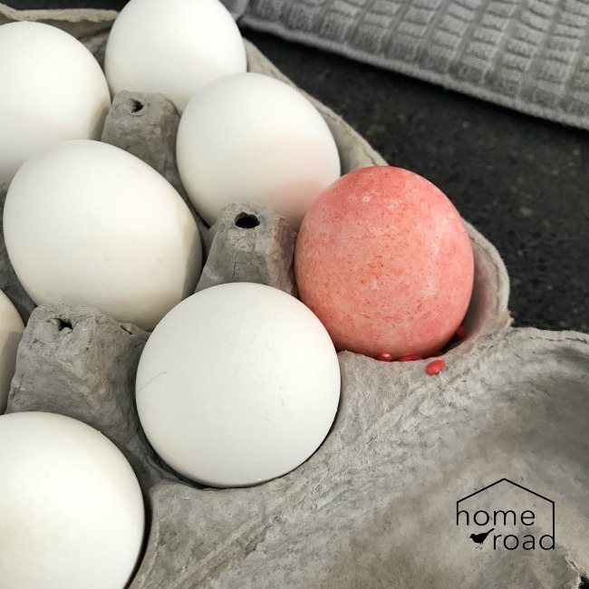 red speckled egg and white eggs