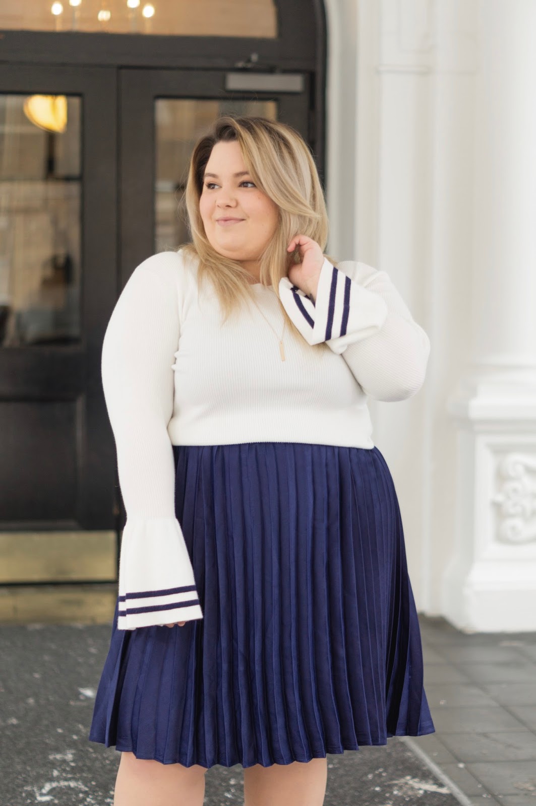full figured fashion, natalie Craig, natalie in the city, plus size fashion blogger, Chicago plus size fashion blogger, embrace your curves, eff your beauty standards, plus size pleated midi skirt, bell sleeve sweater, affordable plus size clothing, eloquii, eloquii Chicago location