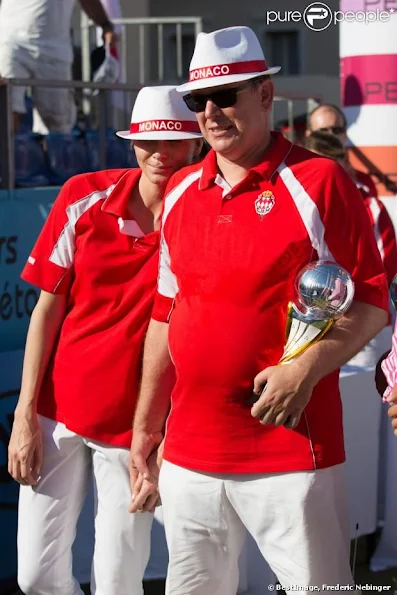 Prince Albert and Princess Charlene attended the 'Monaco Petanque Masters 2013' in front of the Monaco Palace  in Monte-Carlo