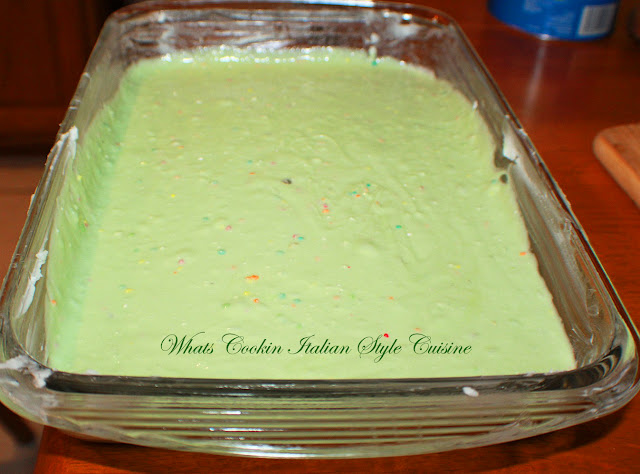 This is a yellow cake mix with pistachio instant pudding added to the mix getting to bake in a glass baking 13 x 9 sheet cake pan