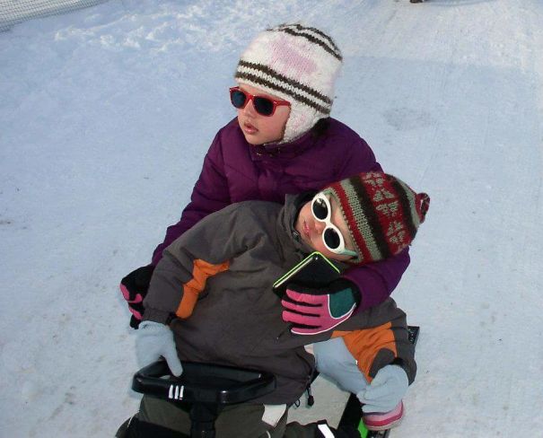 15+ Hilarious Pics That Prove Kids Can Sleep Anywhere - Napping On The Sleigh With Older Sister...