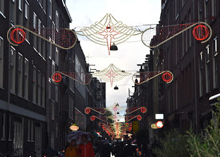 Holiday lights strung above a city street, Amsterdam, The Netherlands