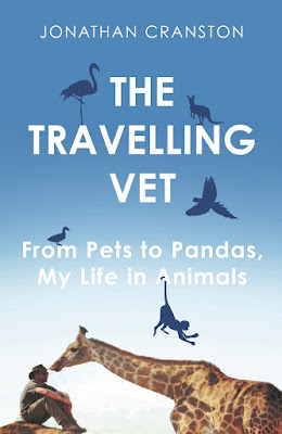 The Travelling Vet Book by Jonathan Cranston pictured with a Giraffe