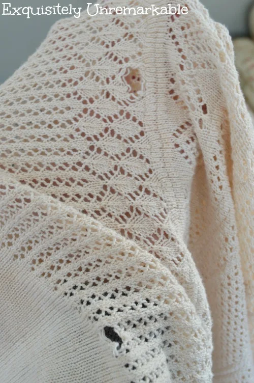 Cream sweater with torn holes