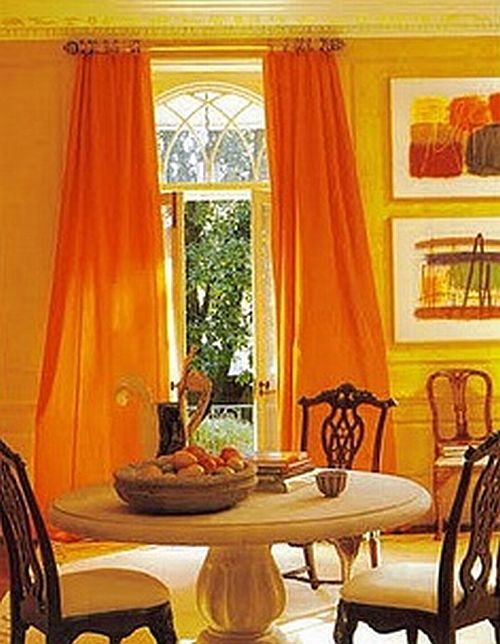 awesome orange dining room with orange curtains and wall