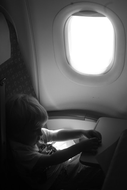 Anton playing with cars on a plane.