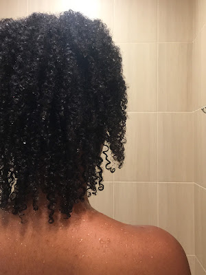 Woman's defined curls after using Indian Aztec clay hair mask.