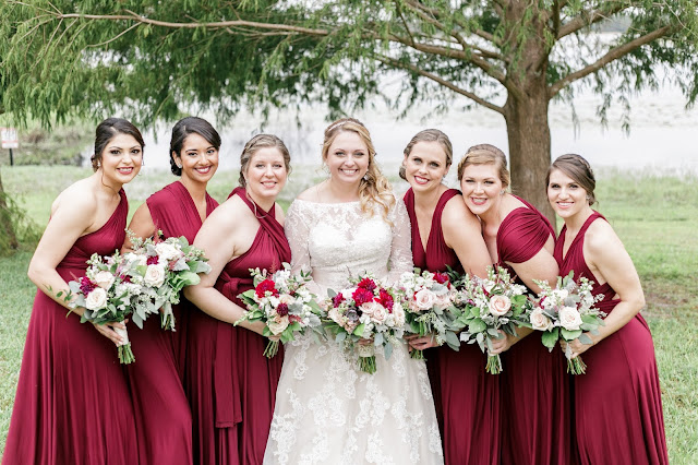 bride and bridesmaids in red dresses