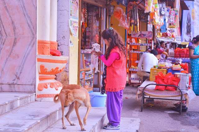 Woman lifting a puppy Garhwali,puppy,kotdwar,sidhbali