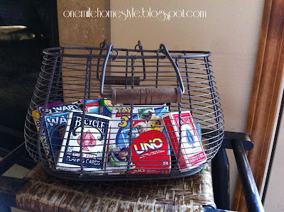 Wire basket to organize card games.