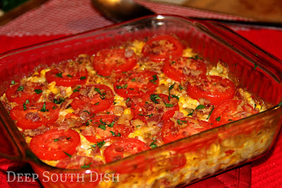 A garden fresh casserole featuring sweet summer corn and tomatoes, onion, sweet bell pepper and garden fresh herbs.